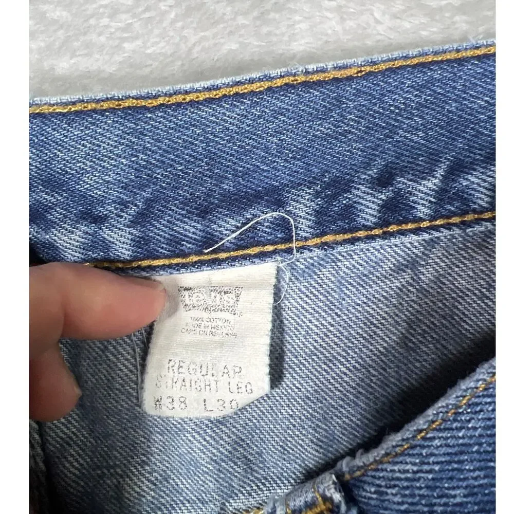 Vintage Levi's 550 Distressed Jeans 38x30 Made in USA Light Wash